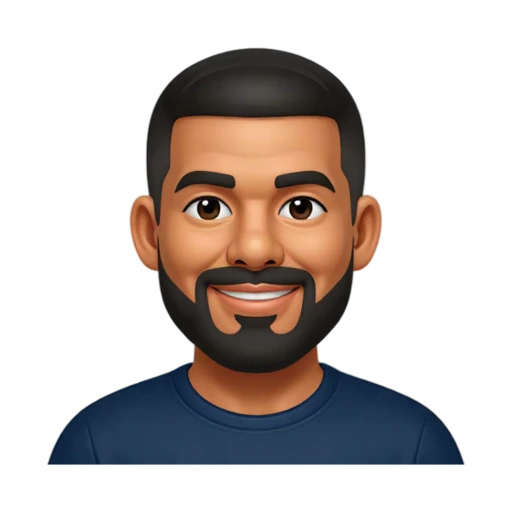 Drake smiling in a dark blue crew-neck shirt