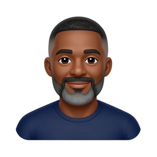 Idris Elba smiling in a navy crew-neck shirt